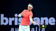 Rafael Nadal hits a forehand against Dominic Thiem.